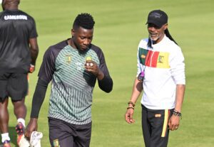 Cameroon's head coach Rigobert Song (R) oversee a training session of his players including Cameroon's goalkeeper Andre Onana on November 27, 2022 at the Al Sailiya SC in Doha on the eve of a Qatar 2022 World Cup football match between Cameroon and Serbia. (Photo by ISSOUF SANOGO / AFP) (Photo by ISSOUF SANOGO/AFP via Getty Images)