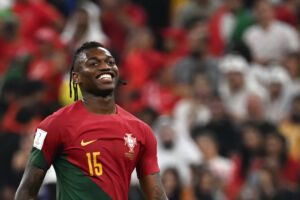Portugal's forward #15 Rafael Leao celebrates after qualifying to the next round after defeating Switzerland 6-1 in the Qatar 2022 World Cup round of 16 football match between Portugal and Switzerland at Lusail Stadium in Lusail, north of Doha on December 6, 2022. (Photo by Anne-Christine POUJOULAT / AFP) (Photo by ANNE-CHRISTINE POUJOULAT/AFP via Getty Images)