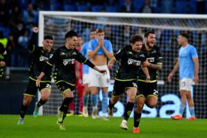 ROME, ITALY - JANUARY 08: Răzvan Gabriel Marin of Empoli FC celebrates scoring his team's second goal, a late equaliser, with his team-mates during the Serie A match between SS Lazio and Empoli FC at Stadio Olimpico on January 08, 2023 in Rome, Italy. (Photo by Marco Rosi - SS Lazio/Getty Images)