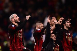 AC Milan's French defender Theo Hernandez (L) and teammates acknowledge the public at the end of during the Italian Serie A football match between AC Milan and Atalanta on February 26, 2023 at the San Siro stadium in Milan. (Photo by Marco BERTORELLO / AFP) (Photo by MARCO BERTORELLO/AFP via Getty Images)