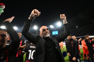 NAPLES, ITALY - APRIL 18: Stefano Pioli, Head Coach of AC Milan, celebrates victory in front of their fans after defeating SSC Napoli during the UEFA Champions League Quarterfinal Second Leg match between SSC Napoli and AC Milan at Stadio Diego Armando Maradona on April 18, 2023 in Naples, Italy. (Photo by Francesco Pecoraro/Getty Images)
