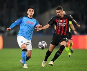 NAPLES, ITALY - APRIL 18: Eljif Elmas of SSC Napoli is challenged by Rade Krunic of AC Milan during the UEFA Champions League Quarterfinal Second Leg match between SSC Napoli and AC Milan at Stadio Diego Armando Maradona on April 18, 2023 in Naples, Italy. (Photo by Francesco Pecoraro/Getty Images)